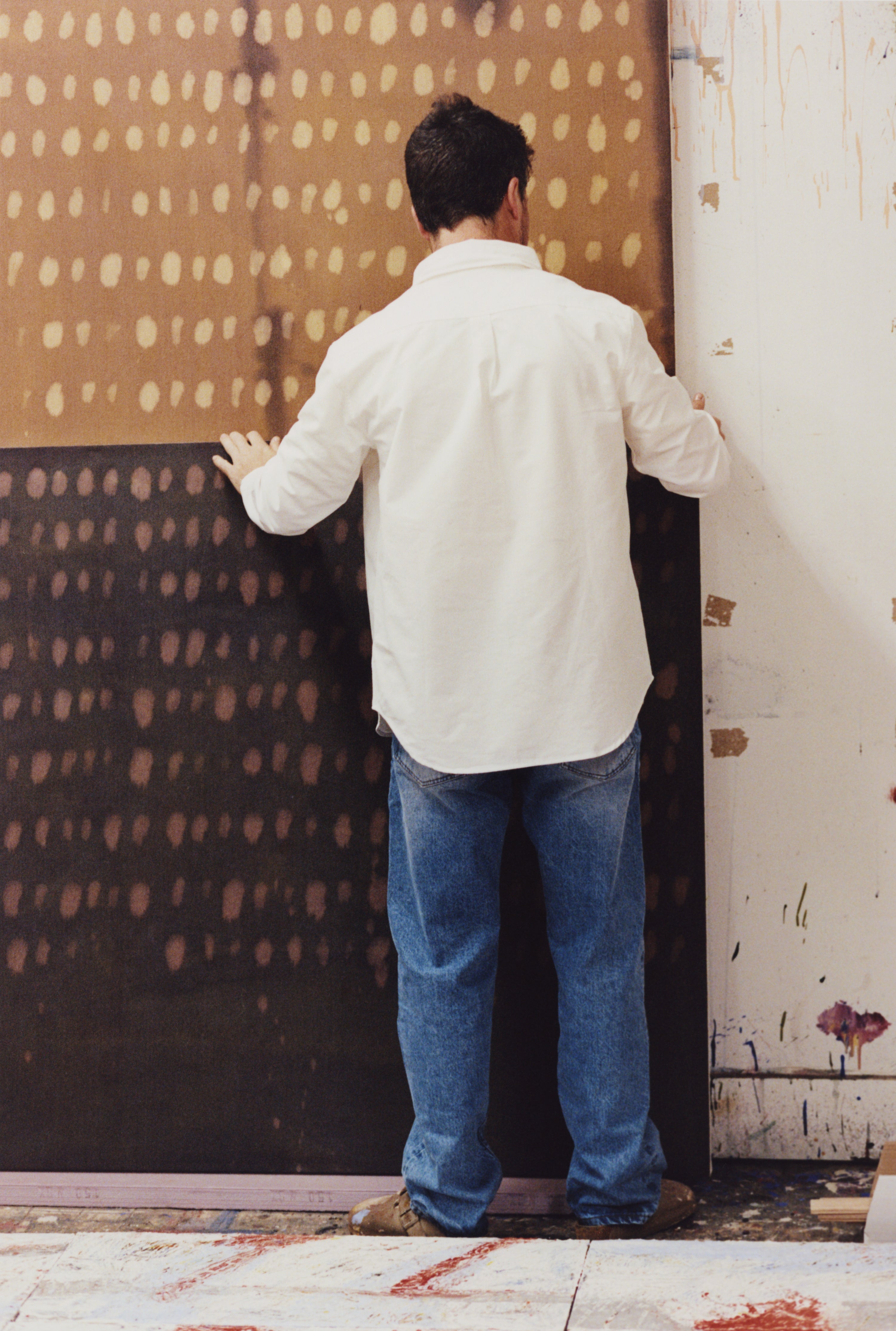 Joe Henry Baker moving his painting