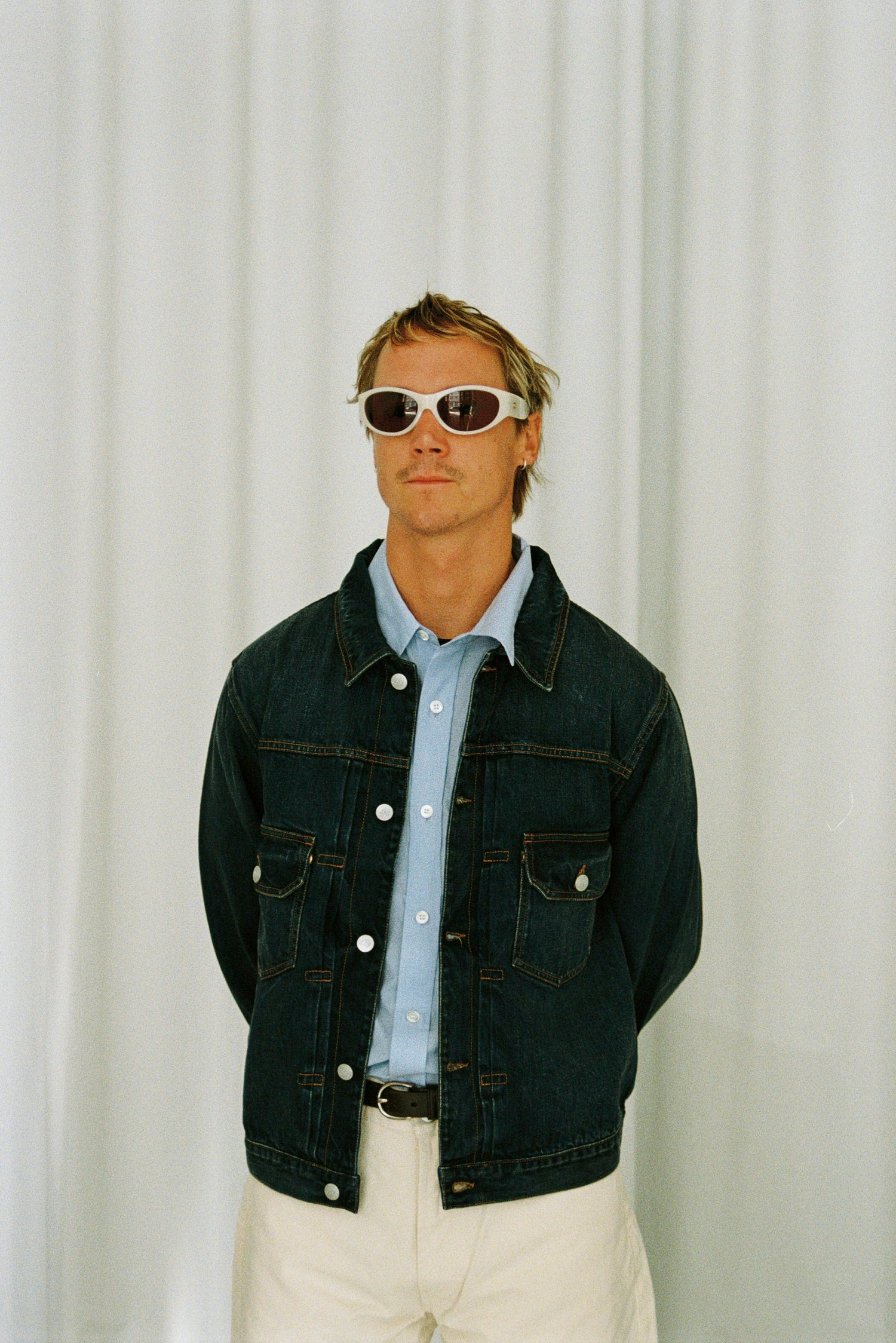 Guy Wearing Knickerbocker Denim Jacket, Blue Shirt and White Pant