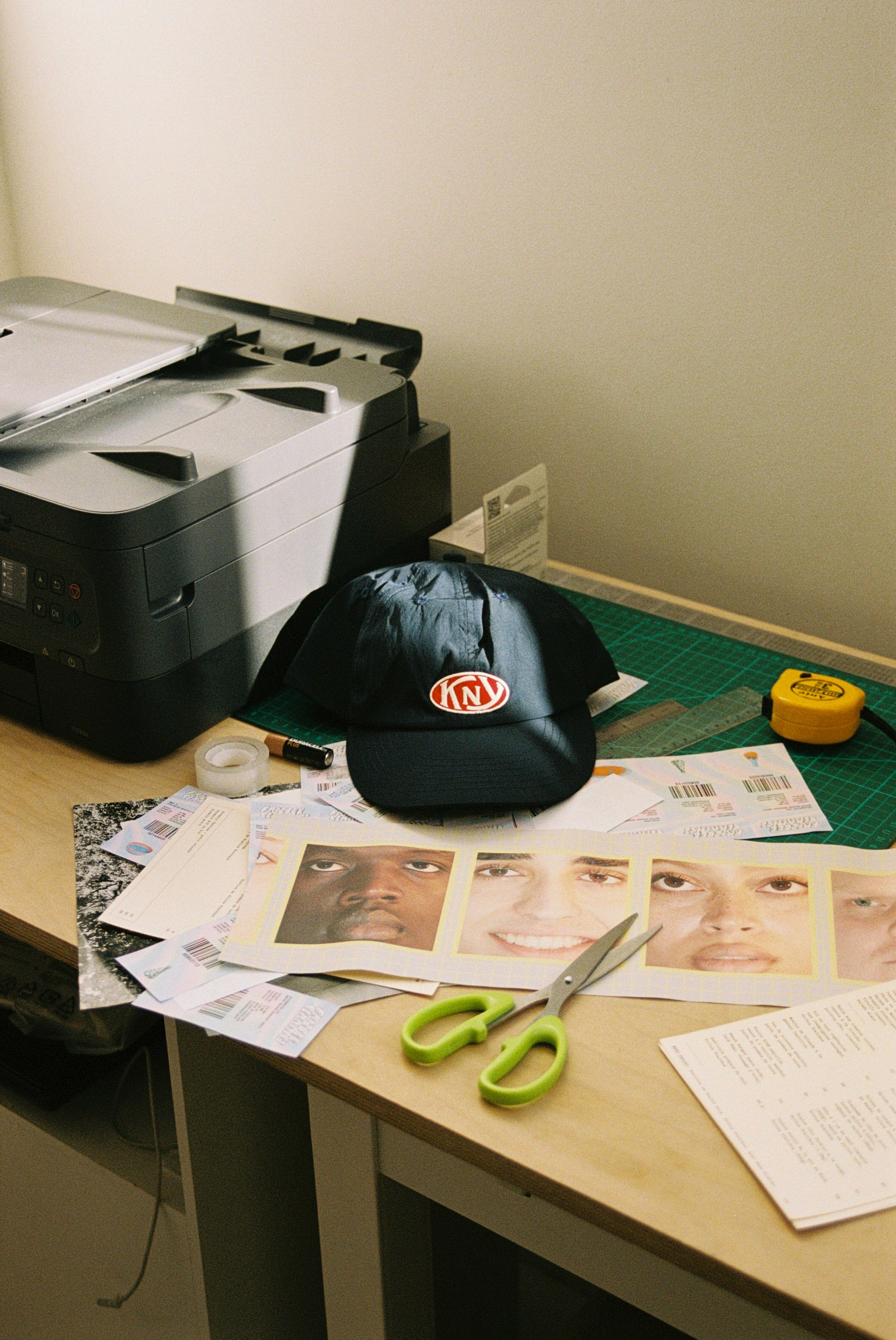 Hat on desktop with design material. 