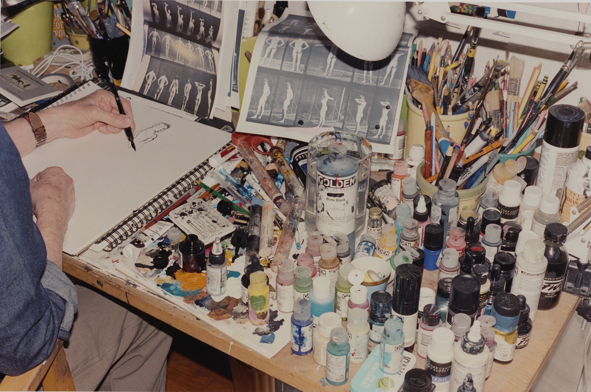 Artist Richard Haines's painting desk covered in inks and paints