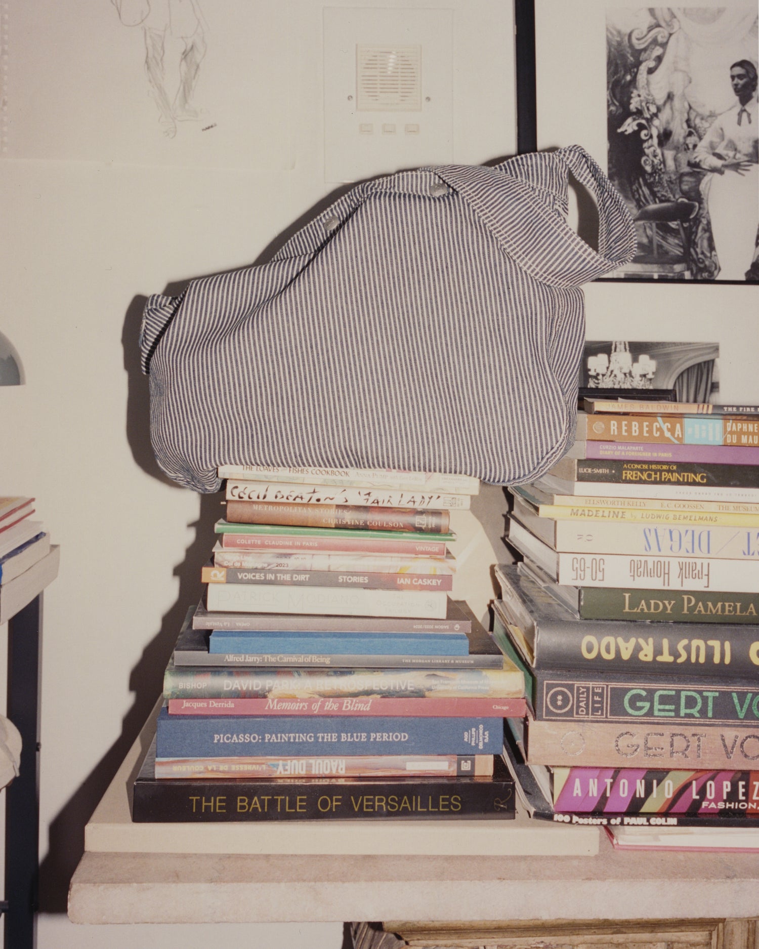 Knickerbocker Paperboy Bag on top of a stack of books